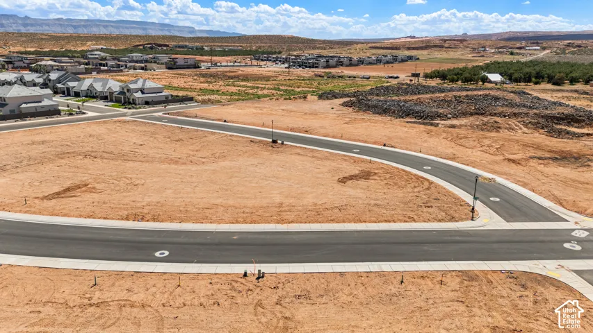 Paved streets with concrete curbing and street lights define the developed infrastructure