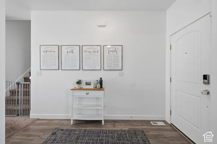 Wood-finish flooring with crisp white baseboards