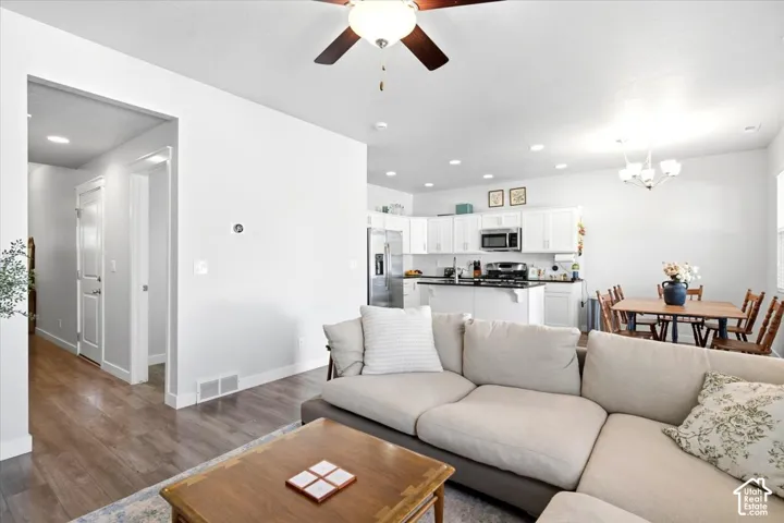 Wood-finish flooring throughout, paired with recessed lighting