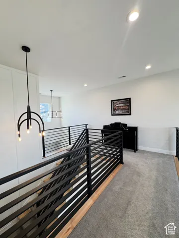 Modern black metal horizontal bar railing with wood-finish stairs