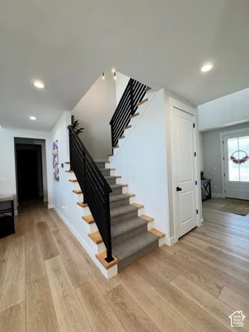 Wood-finish flooring throughout the entry and main hallway