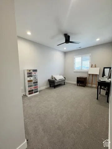 Recessed lighting, ceiling fan, carpeted flooring, window with plantation shutters