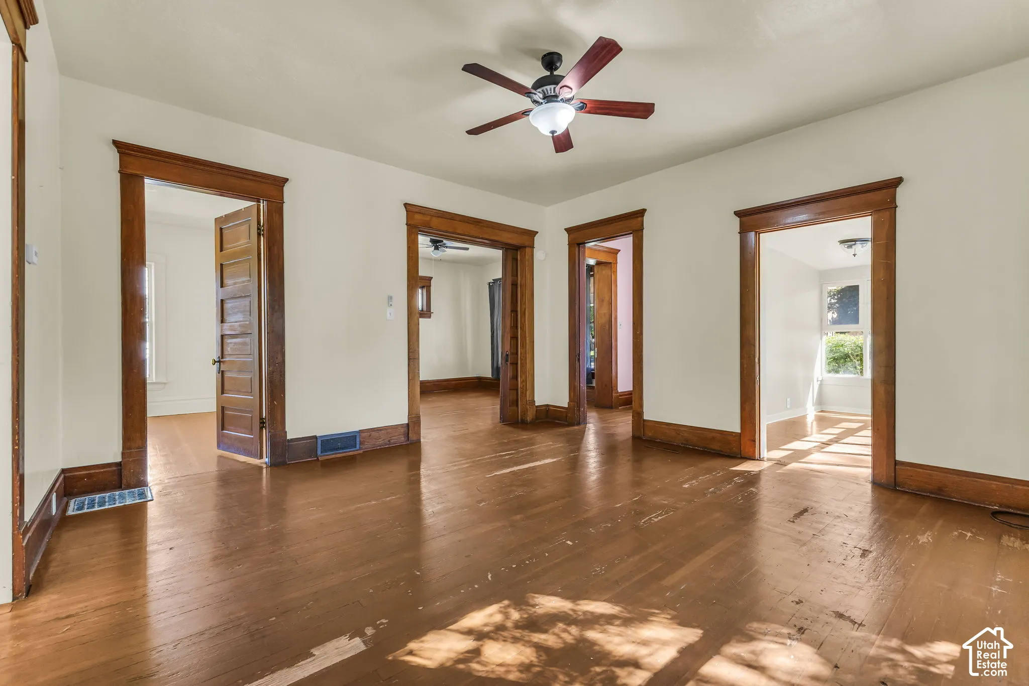 Hardwood-style flooring throughout with contrasting trim work and doors