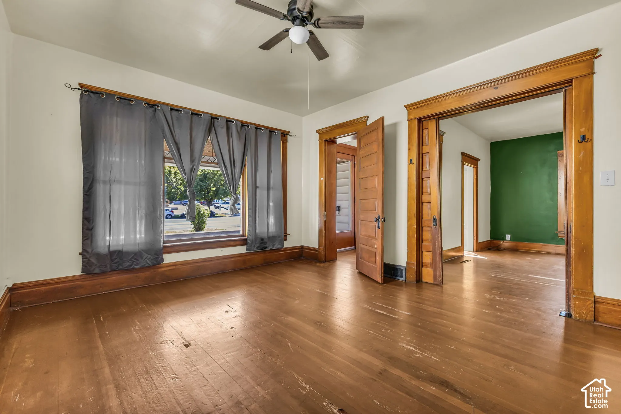 Wood-finish flooring throughout, complemented by wood trim and interior doors