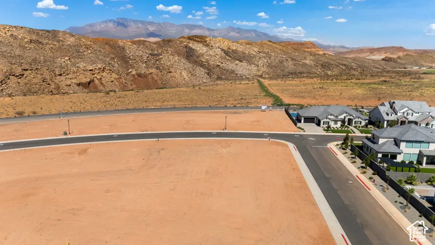 Expansive undeveloped land parcel with mountain backdrop