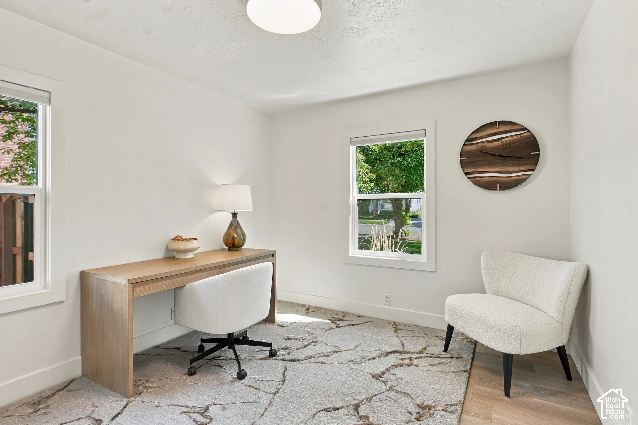 White walls with trim, recessed lighting, and wood-finish flooring