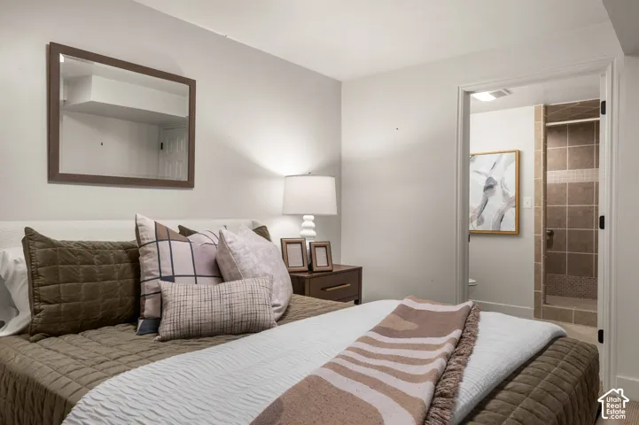 Recessed lighting and a wall-mounted mirror complement this space