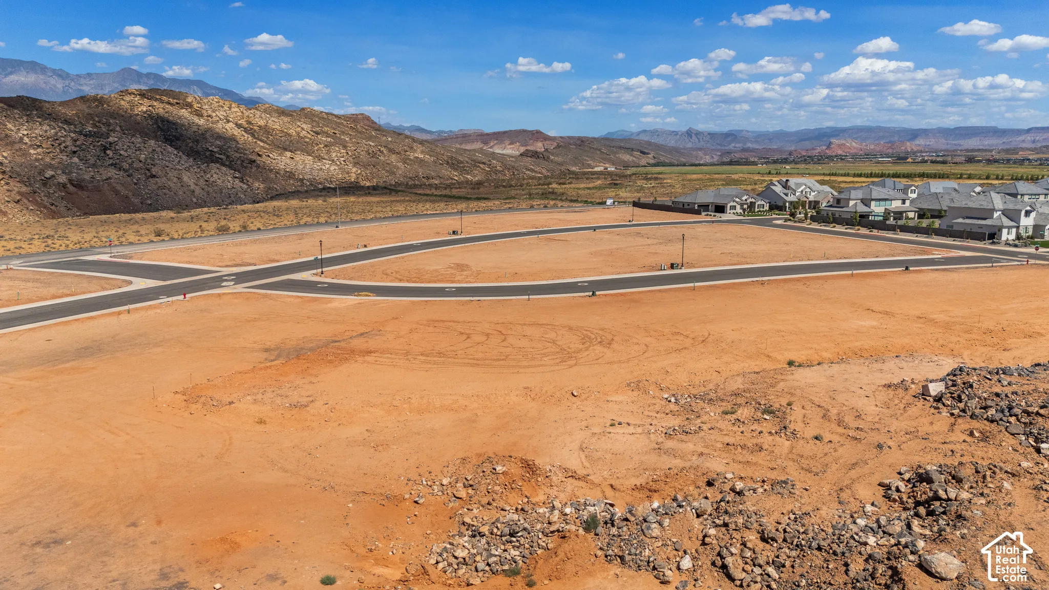 Expansive undeveloped land featuring prepared building pads