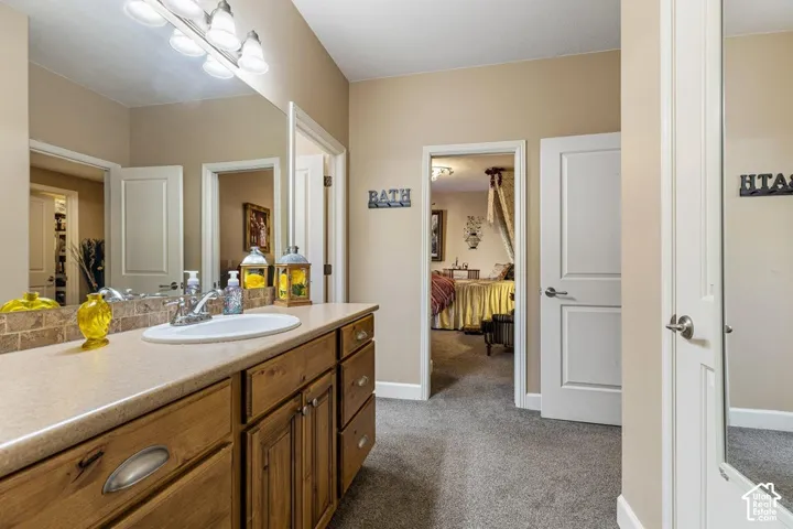 Double vanity with an integrated sink and wood cabinetry