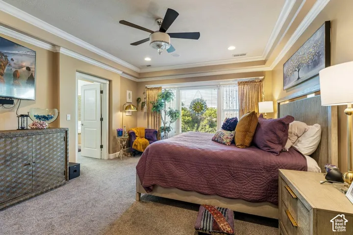 Recessed lighting, ceiling fan, crown molding, double French doors, large window with blinds