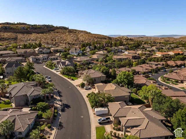 Residential neighborhood setting with mature landscaping and clear skies