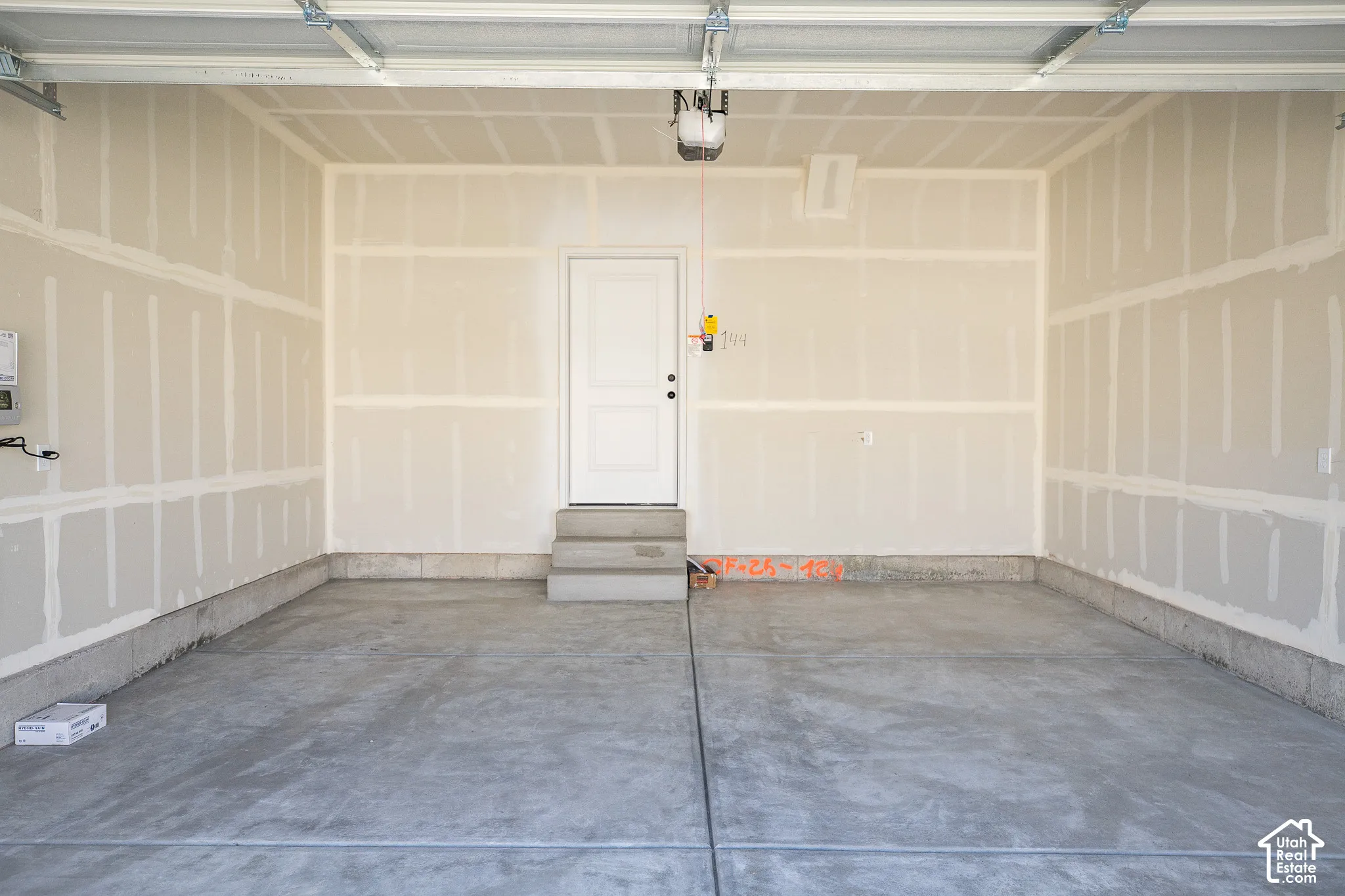 Two-car garage with taped finish.