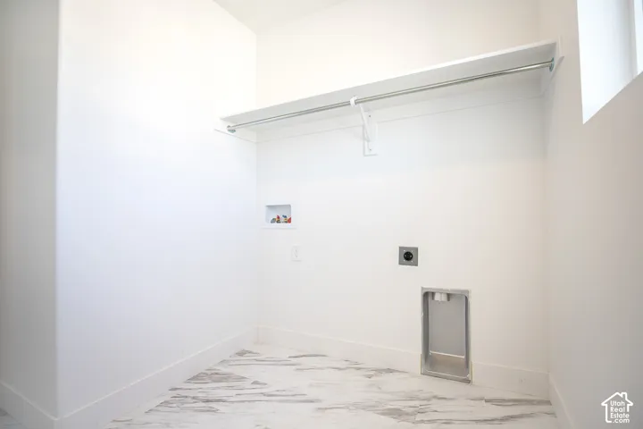 Full-size, dedicated laundry room with natural light and washer/dryer hookups.