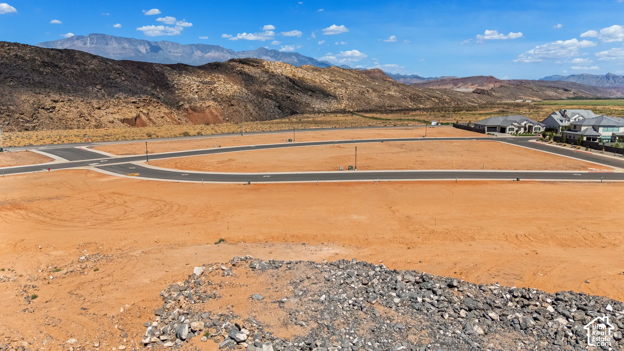 Graded building lots with paved street access and established residential structures