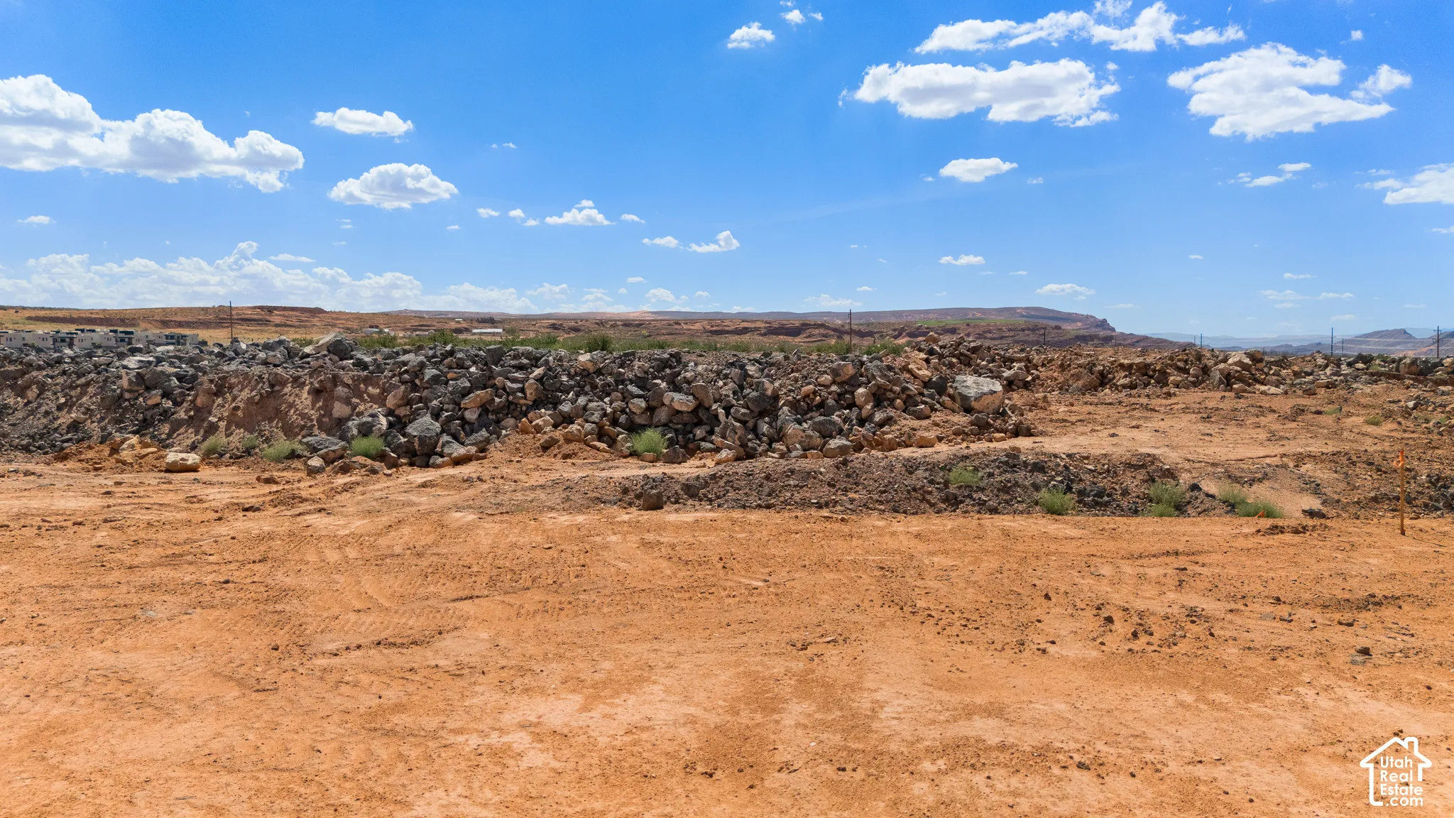 Expansive land parcel featuring natural terrain and visible rock formations