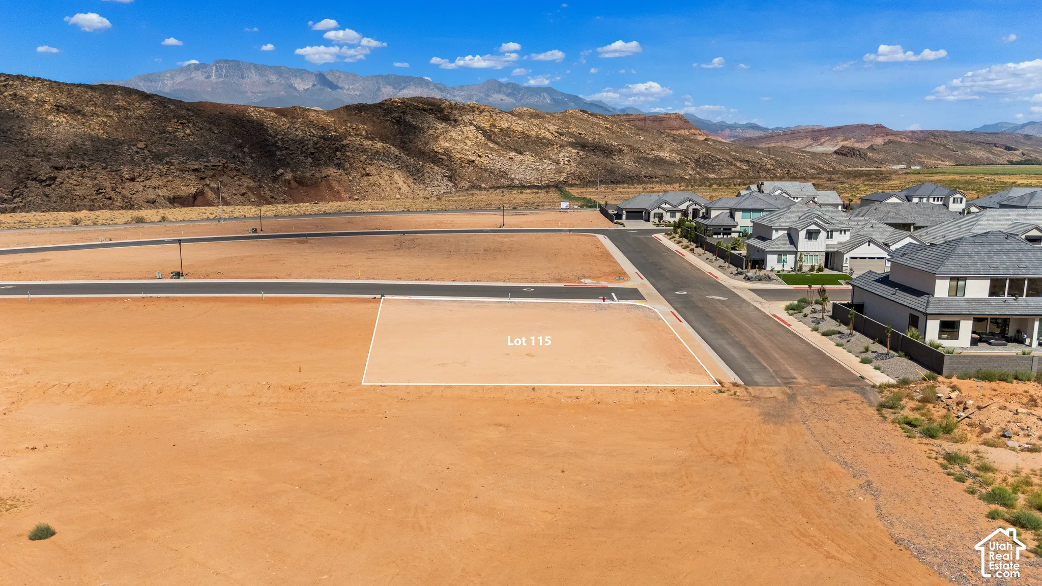 Lot 115 featuring open terrain and adjacent paved street