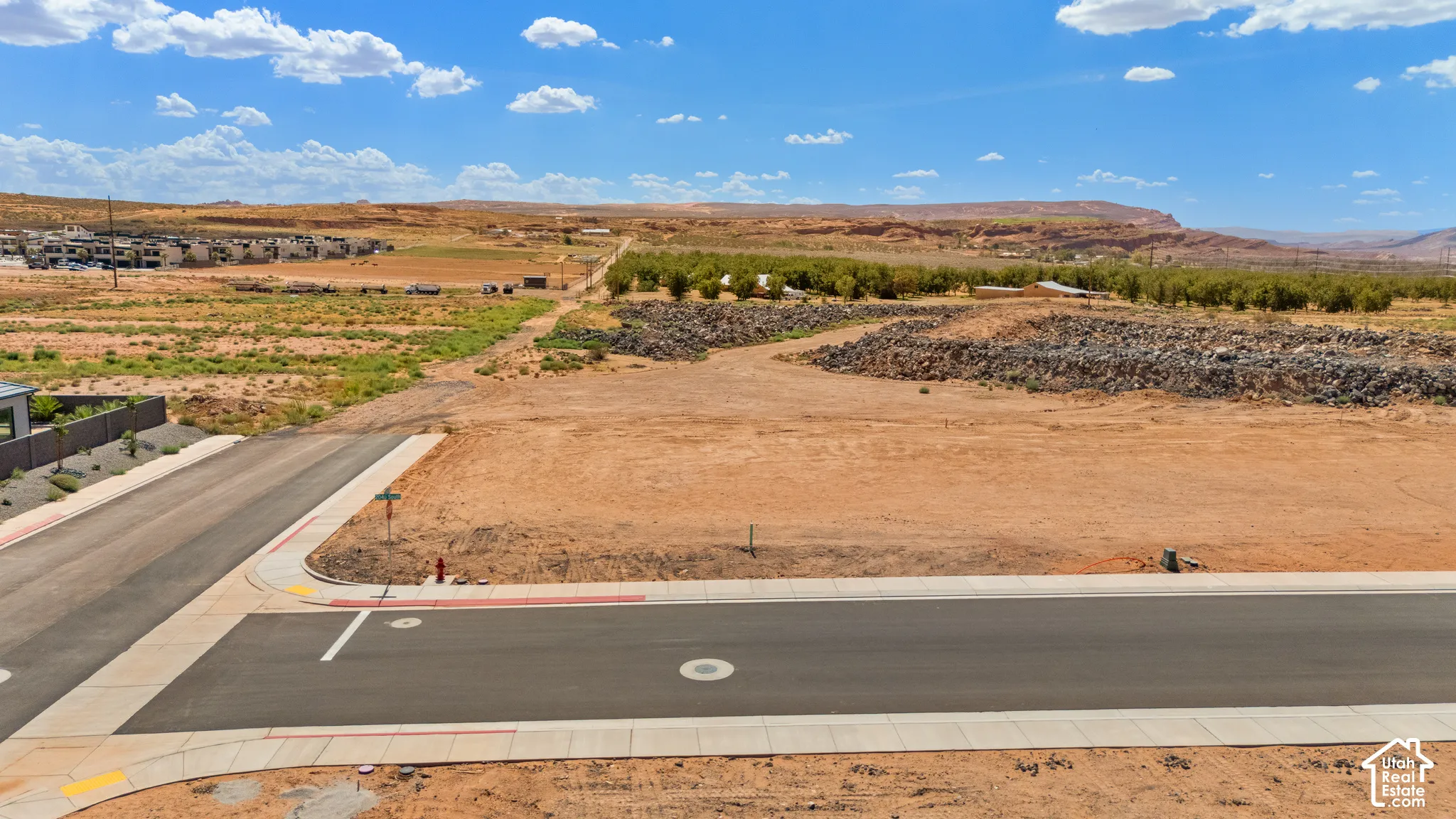 Paved residential street with curb and sidewalk