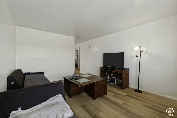 Wood-finish flooring throughout the space
