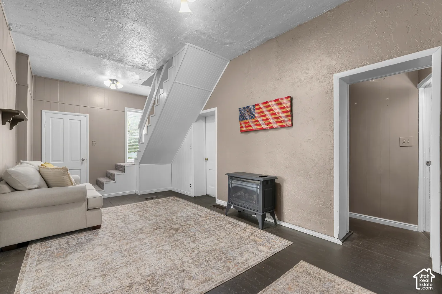 Dark wood-finish flooring with light-colored walls