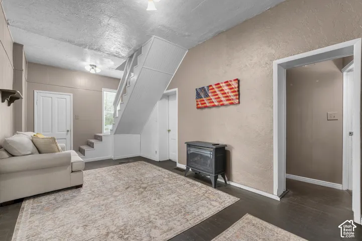 Dark wood-finish flooring with light-colored walls
