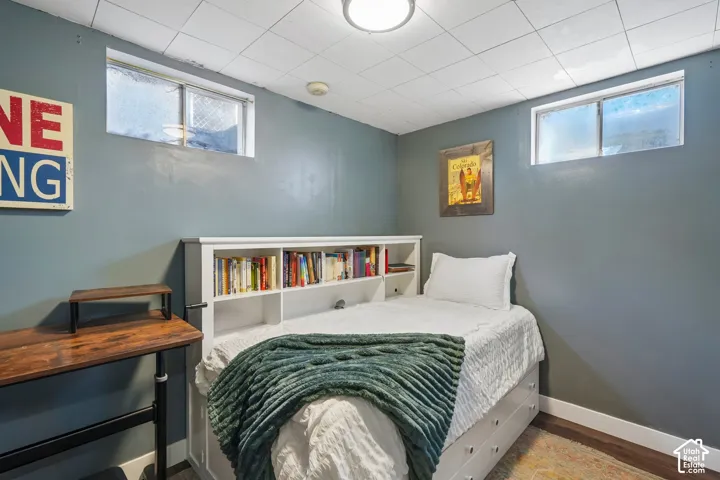 Recessed ceiling light fixture illuminates this room featuring two windows