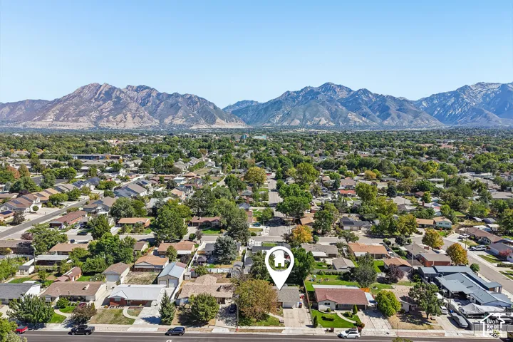 Expansive mountain backdrop with a residential neighborhood