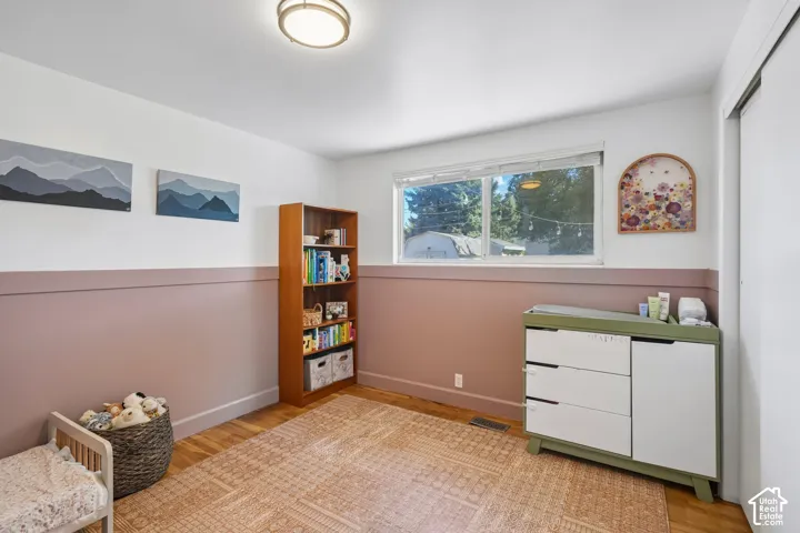 Wood-finish flooring with a flush-mount ceiling light
