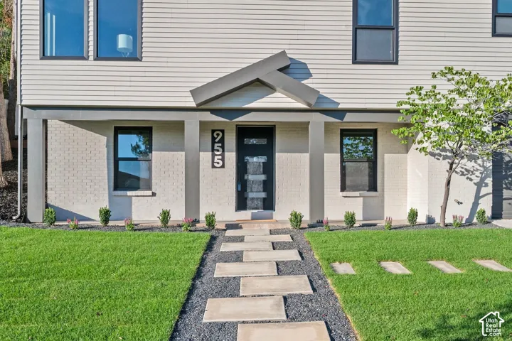 Modern exterior featuring horizontal siding and brick accents