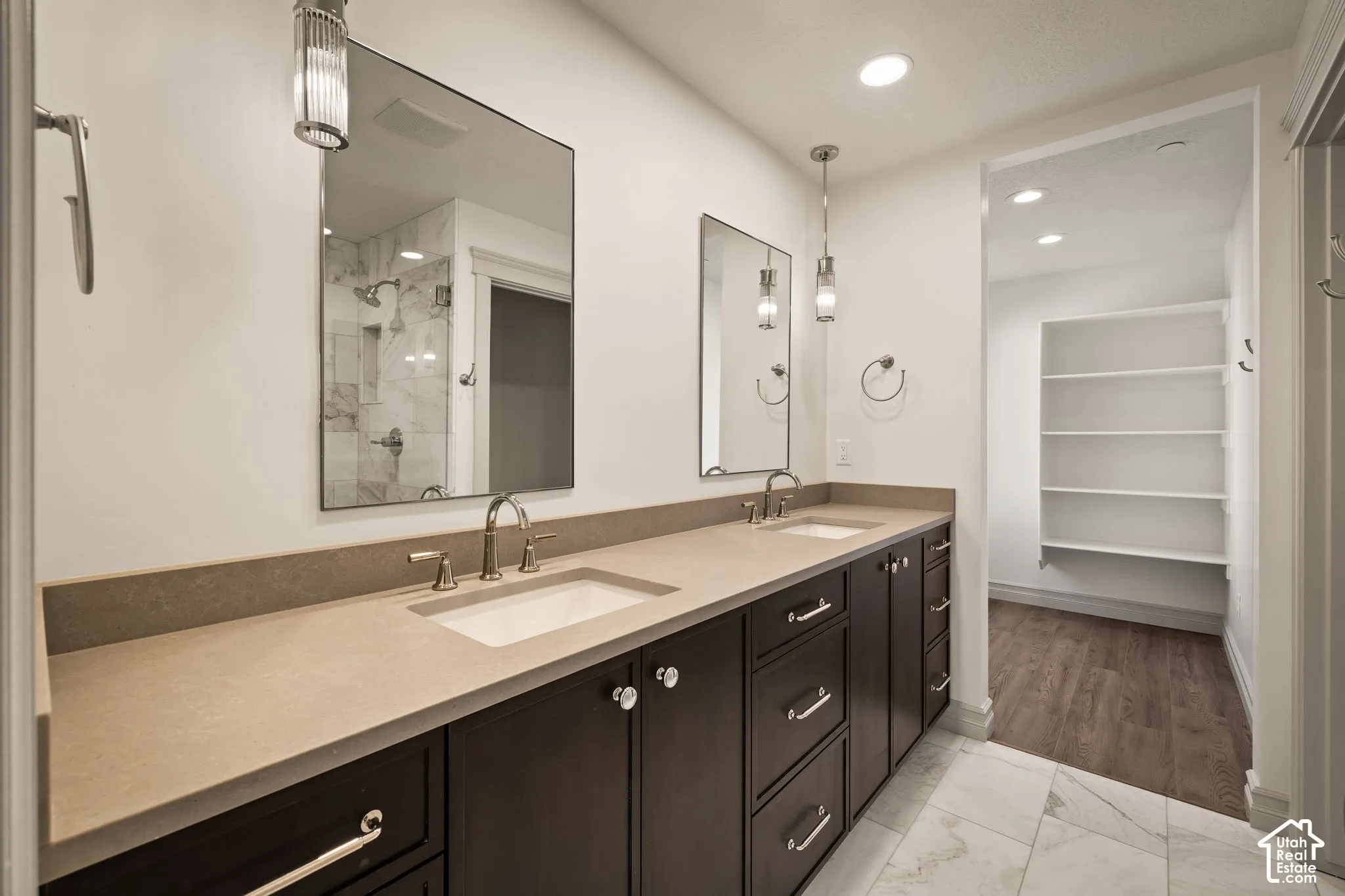 Dual vanity with integrated sinks and sconce lighting