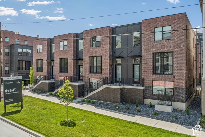 Brick and dark panel exterior with multiple windows