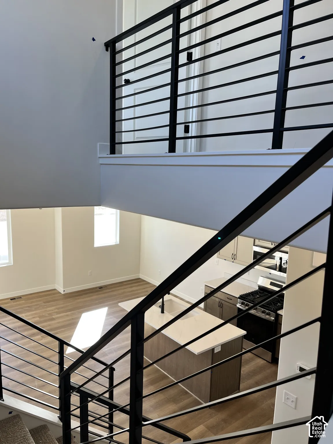 Open-concept living space featuring wood-finish flooring