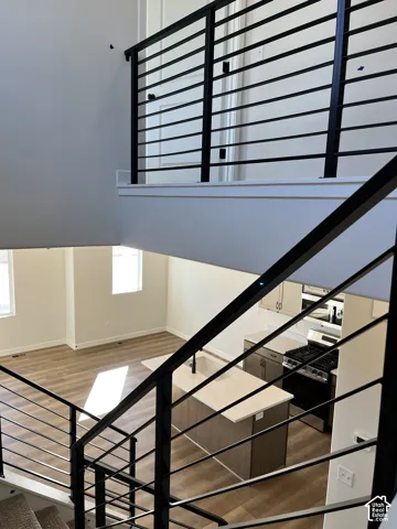 Open-concept living space featuring wood-finish flooring