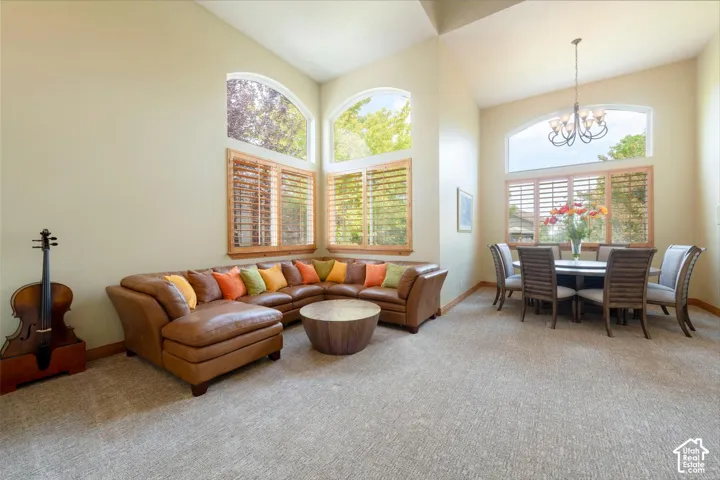 Vaulted ceilings, arched windows, and light-toned walls with wood trim