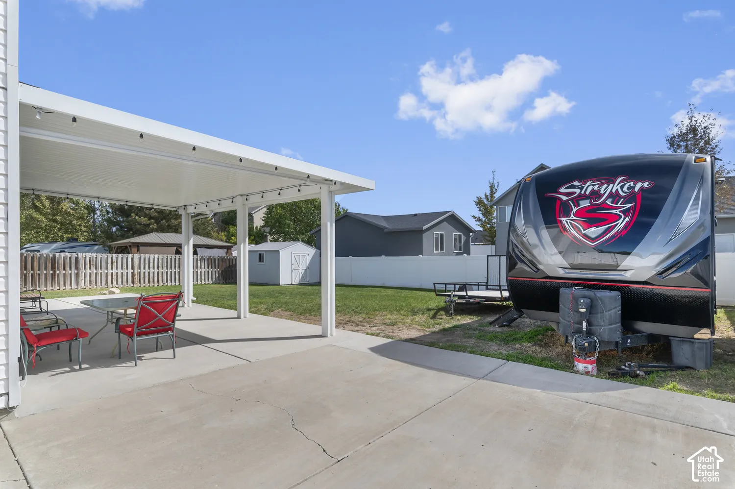 Covered patio featuring a solid roof and integrated lighting