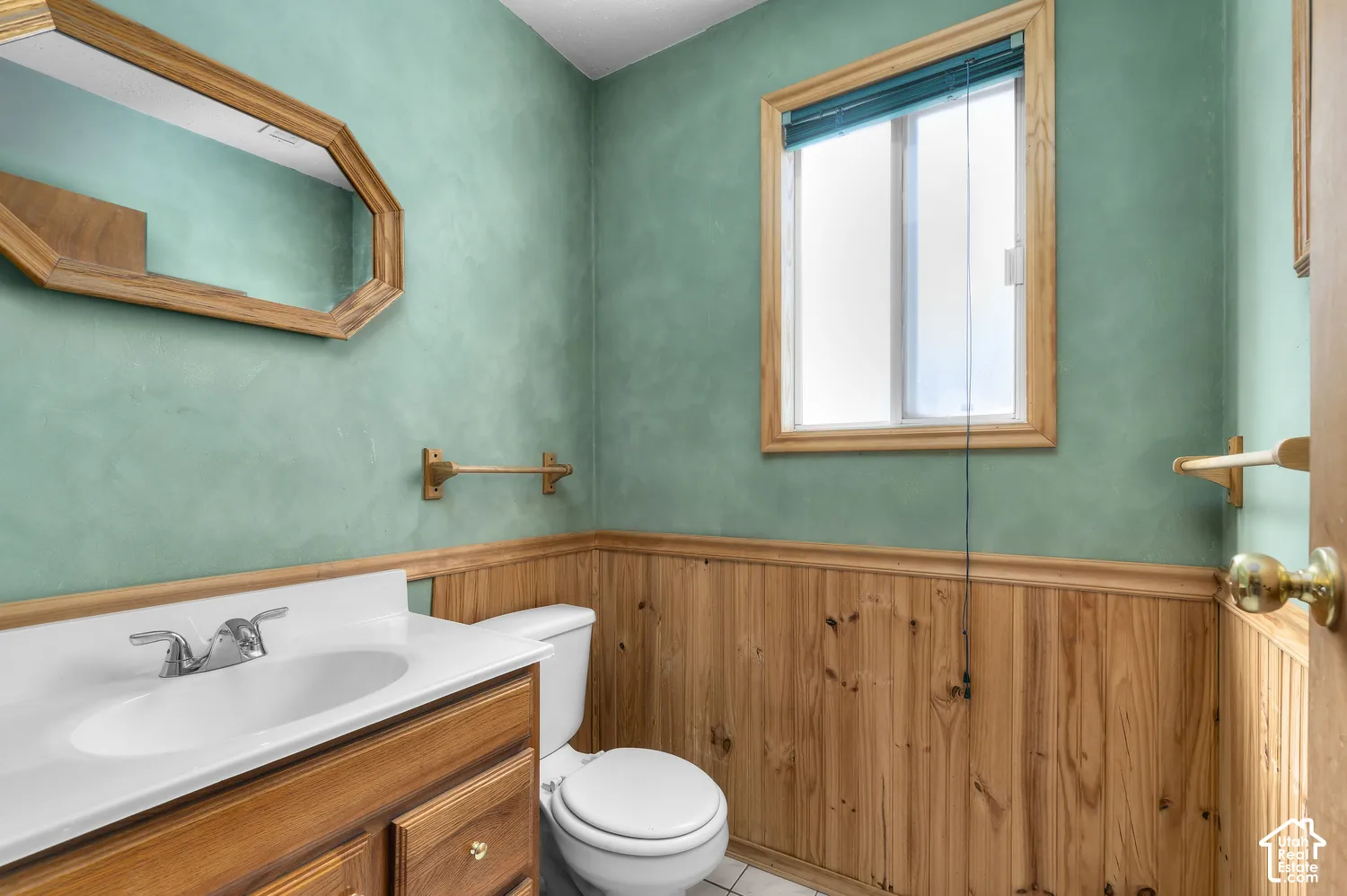 Wood-paneled wainscoting with a wood trim accent