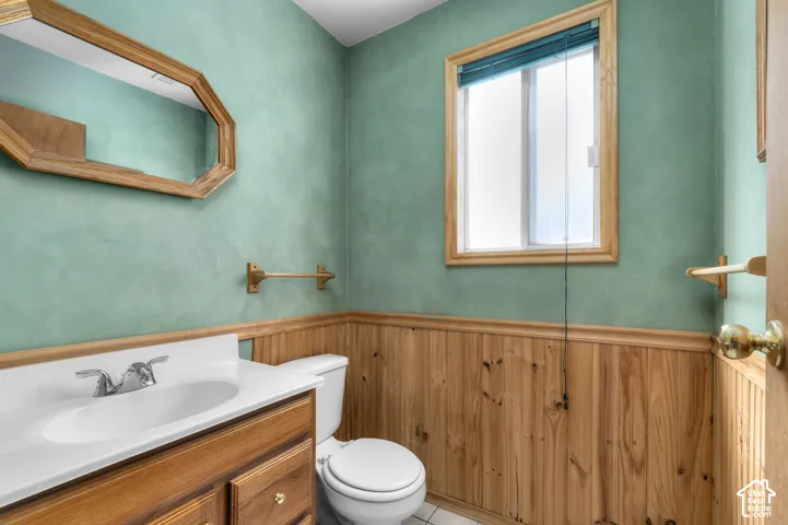 Wood-paneled wainscoting with a wood trim accent