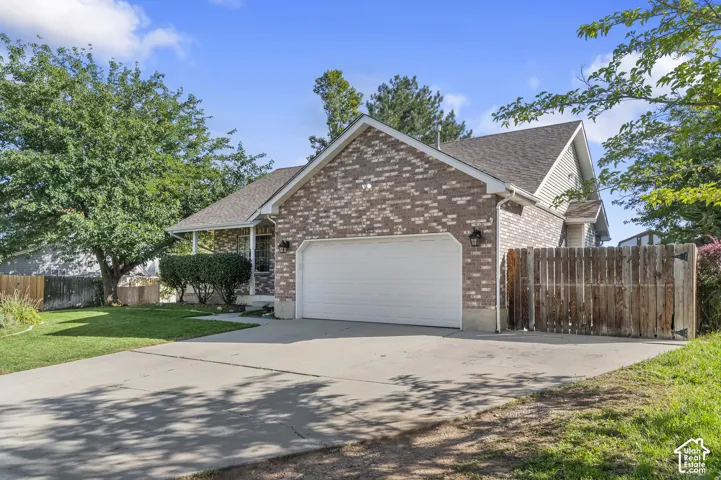 Brick-front exterior with an attached two-car garage