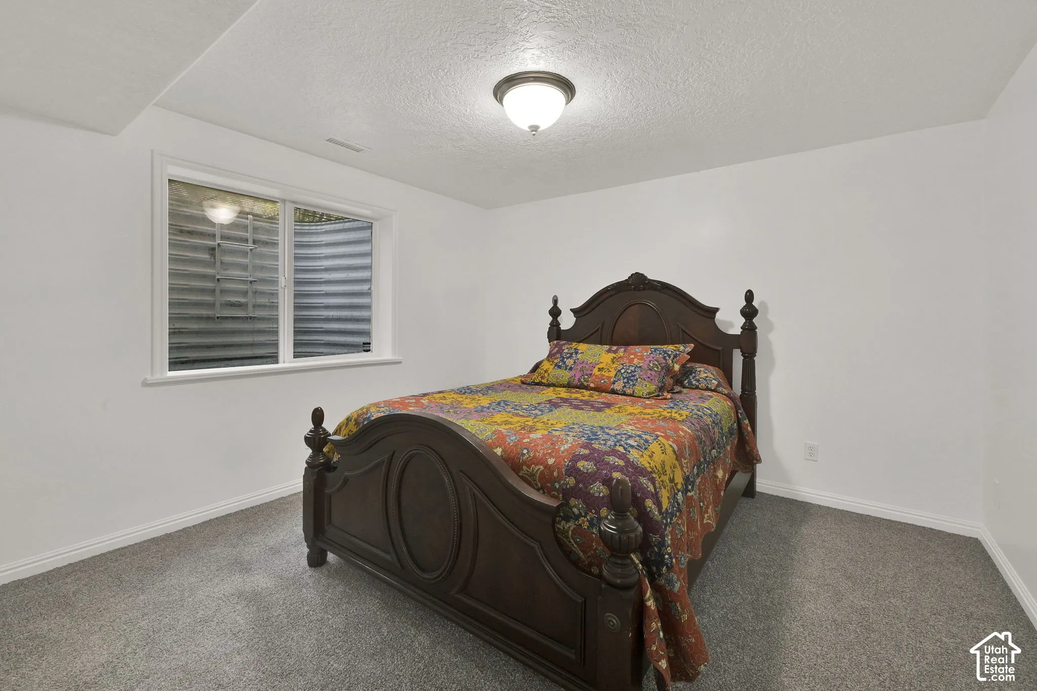 Neutral tone wall finishes, white trim, and a semi-flush mount ceiling light