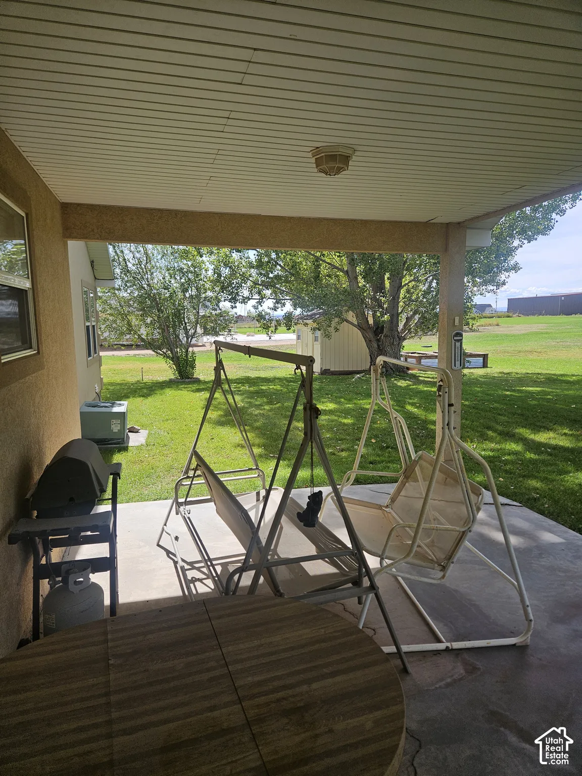 Covered patio featuring a concrete surface and stucco exterior