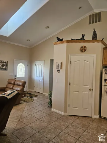 Vaulted ceiling with skylight and recessed lighting