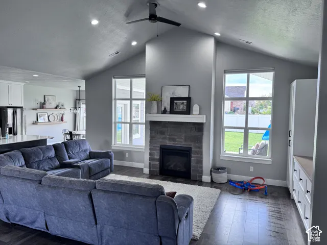 Vaulted ceiling with recessed lighting and a ceiling fan