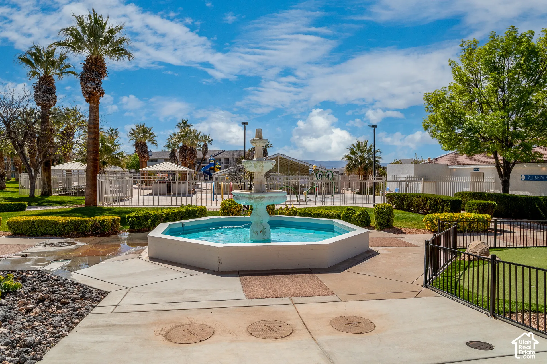 Central tiered fountain looking toward main amenities near clubhouse entrance