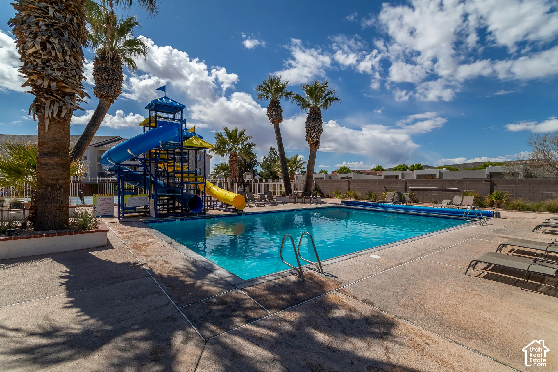 Outdoor swimming pool with a water slide
