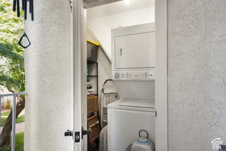Dedicated laundry area with stacked washer and dryer