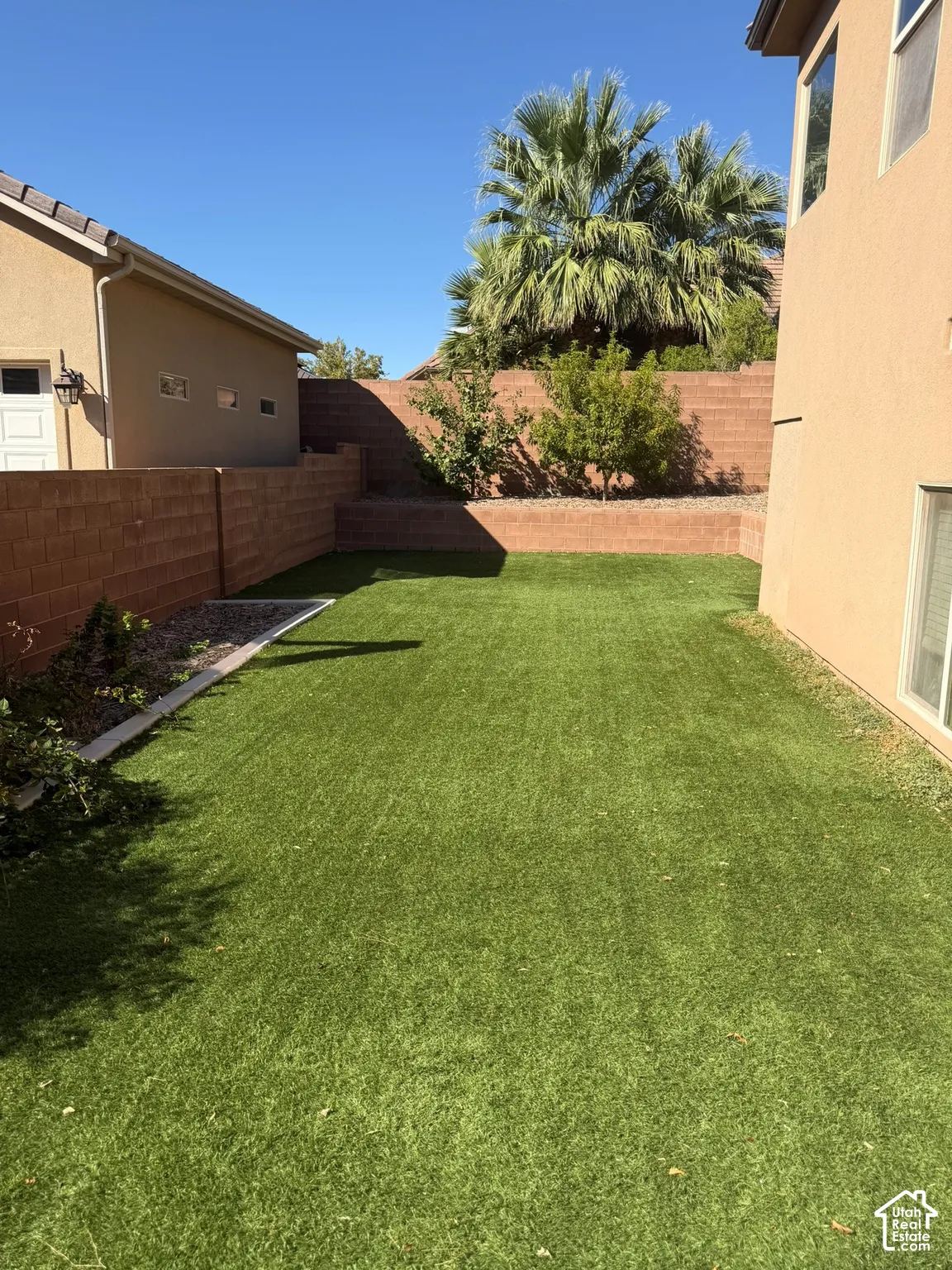 Expansive artificial turf lawn with tiered retaining walls