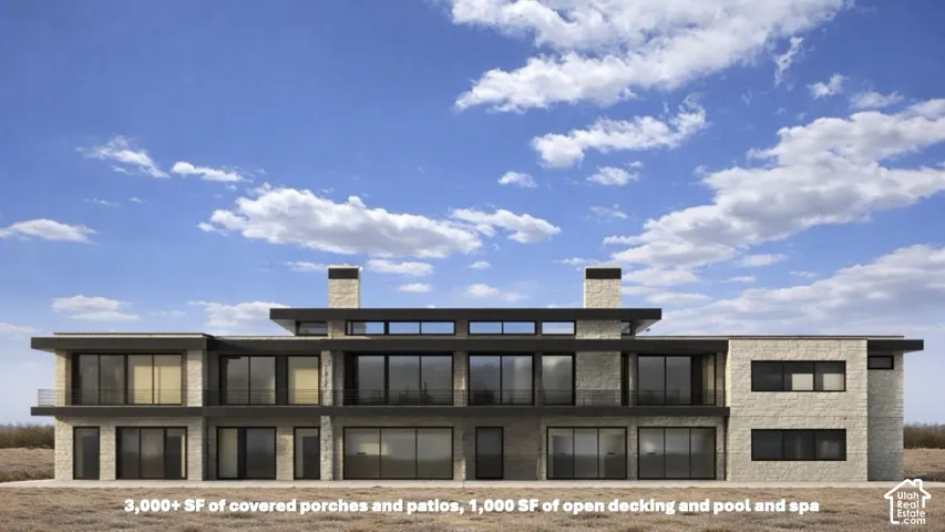 Modern architecture featuring a multi-level design, extensive glazing, stone-clad exterior, and multiple covered outdoor areas