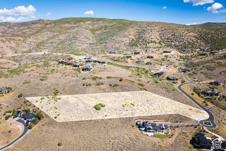 Expansive vacant lot featuring a natural, arid landscape