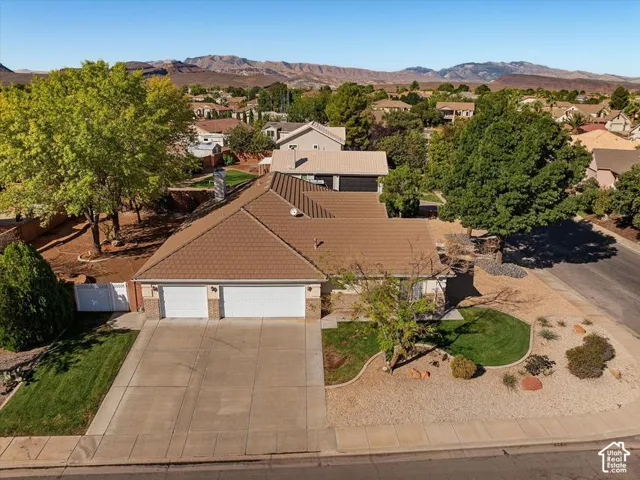 Concrete driveway leading to a two-car garage