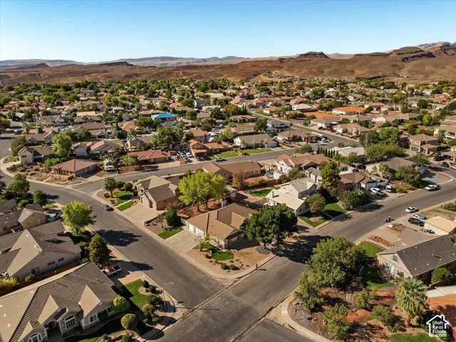 Residential neighborhood featuring established homes, mature trees, and paved streets