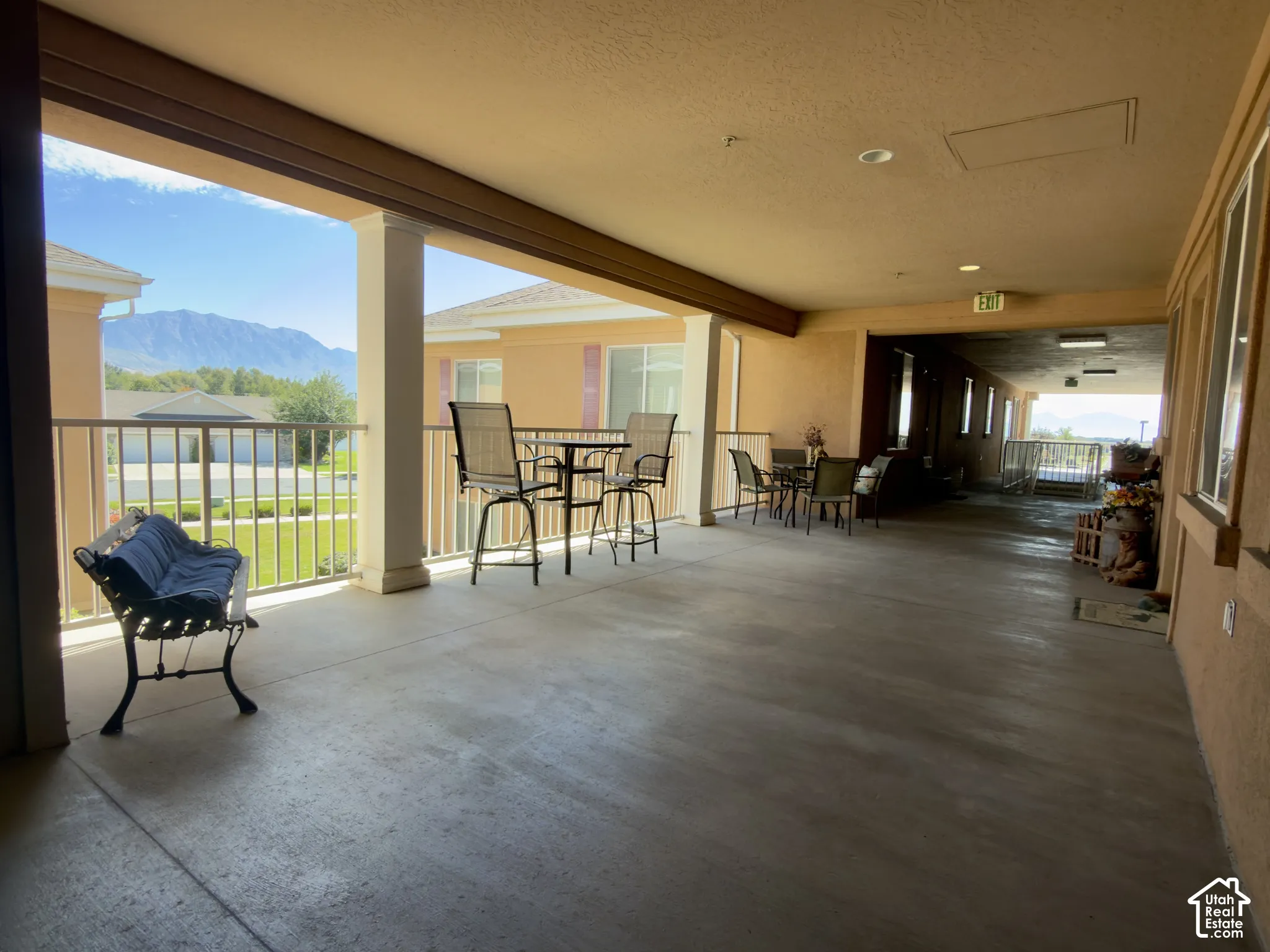 Extended outdoor covered patio just outside the front door